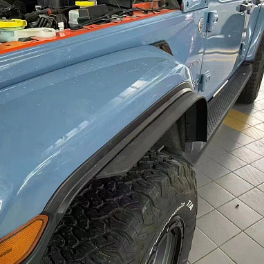 Image of a Jeep Wrangler NEW JEEP JL PARTS Jeep Wrangler JL Fender Extensions fit  on OEM Fenders 4pcs
