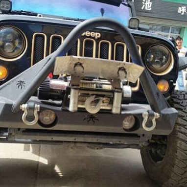 Image of a Jeep Wrangler    JW0329 Poison Spyder Style Steel Front Winch Stubby Bull Bar