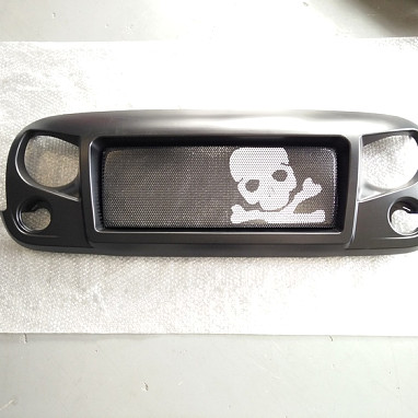 Image of a Jeep Wrangler Angry Grilles  Jeep Wrangler JK Spartan Skull Style Angry Grille Matte black